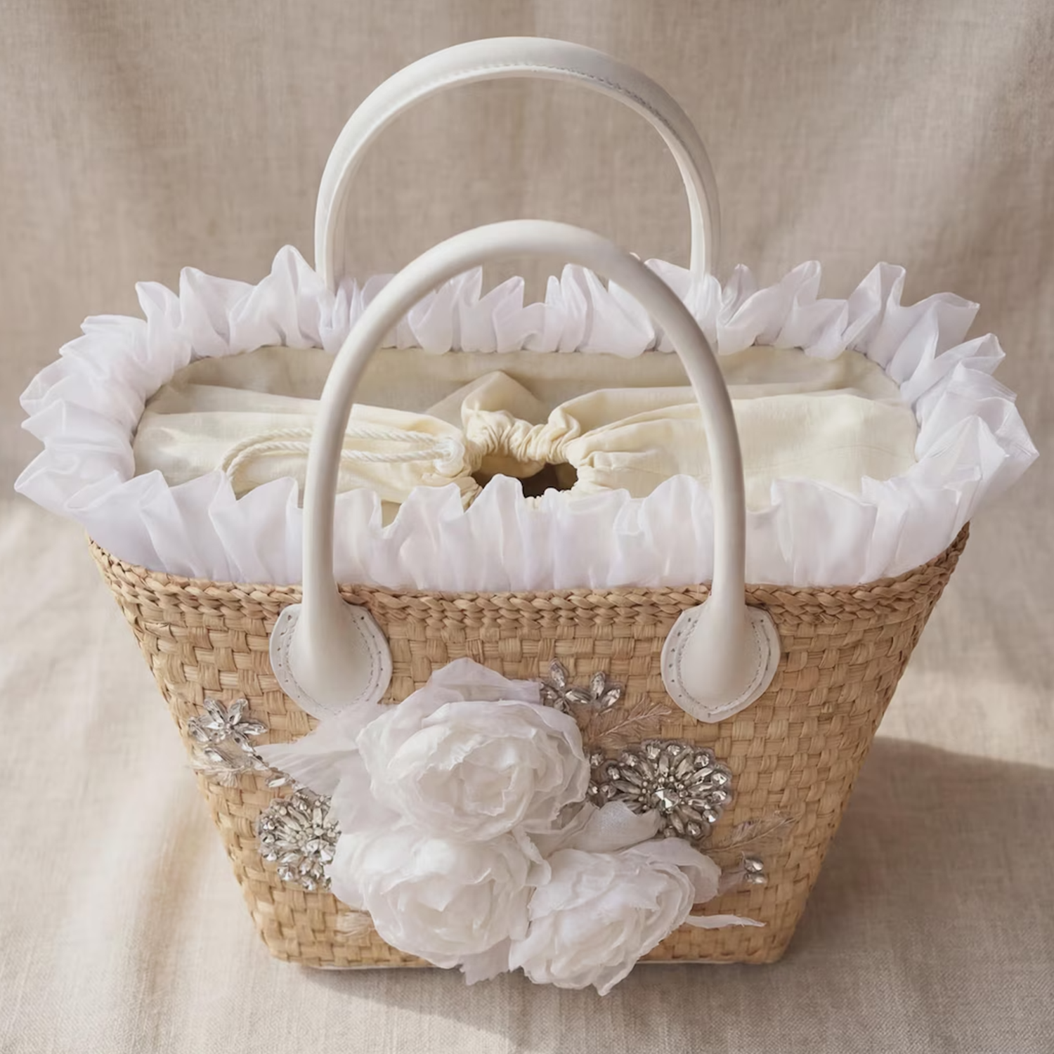 Natural Beige Woven Straw Trapezoidal Hand Tote With Sheer White Floral Rhinestone Front Appliqué, Frilly Rim Trim And Removable Drawstring Fabric Liner
