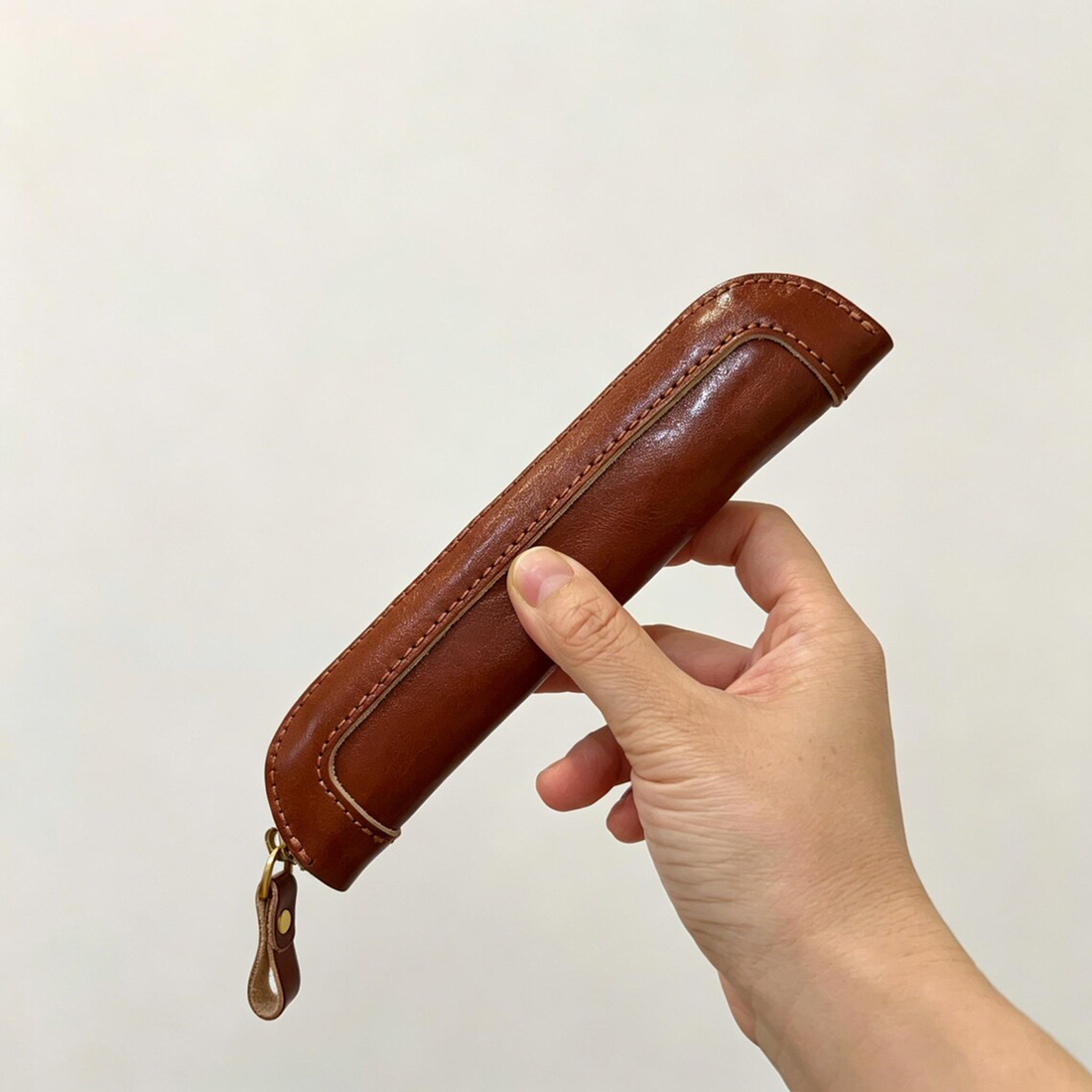 Slim Elongated Stationery Sleeve With Contrast Hand Stitched Edging, Full-Length Brass Zip Closure And Soft Fuzzy Interior Lining For Writing Tool Storage