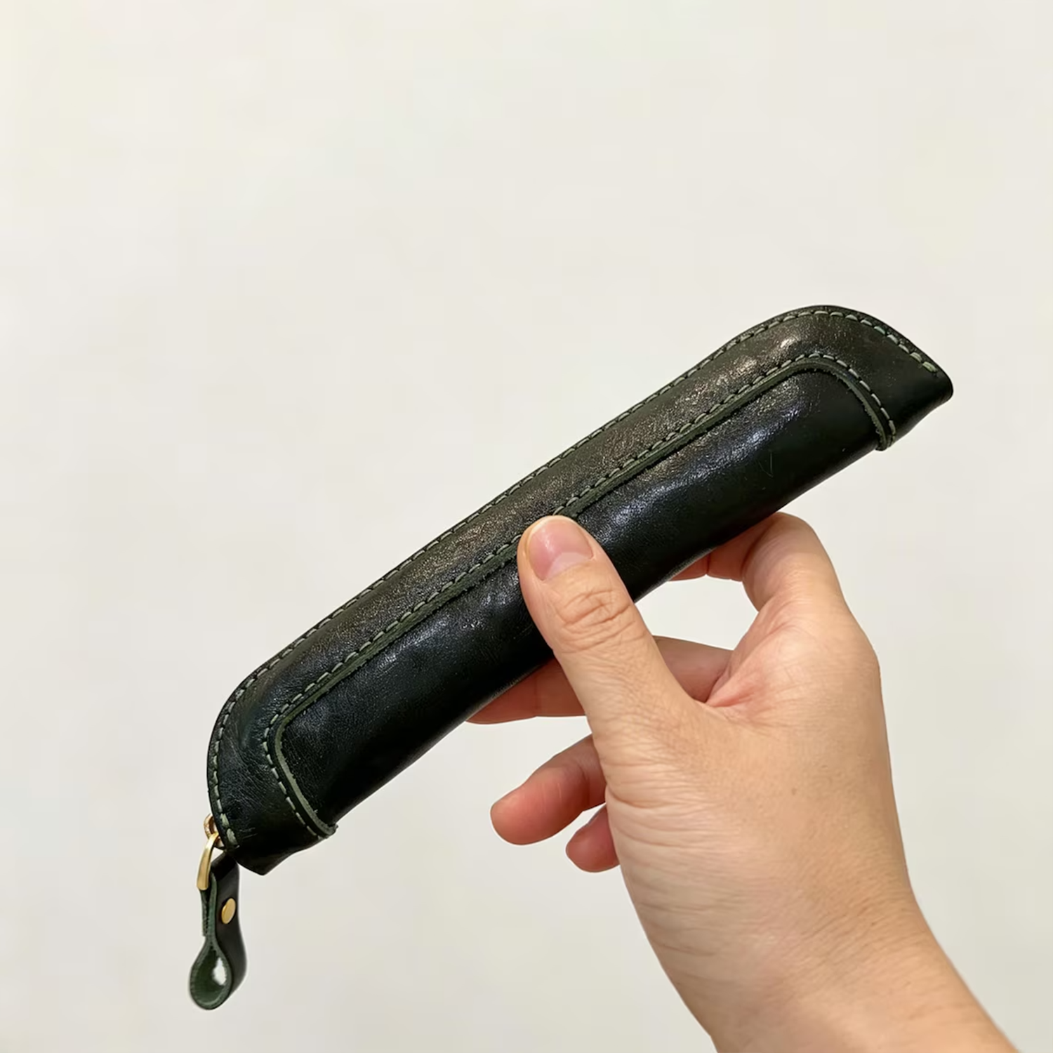 Slim Elongated Stationery Sleeve With Contrast Hand Stitched Edging, Full-Length Brass Zip Closure And Soft Fuzzy Interior Lining For Writing Tool Storage