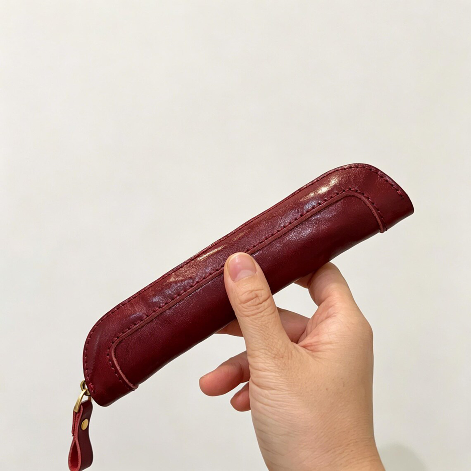 Slim Elongated Stationery Sleeve With Contrast Hand Stitched Edging, Full-Length Brass Zip Closure And Soft Fuzzy Interior Lining For Writing Tool Storage