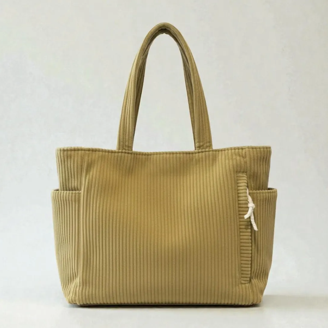 Vertical Ribbed Corduroy Rectangular Shoulder Tote With Dual Side Slip Pockets, Fabric Drawstring Zip Compartment And Integrated Matching Wide Fabric Top Handles
