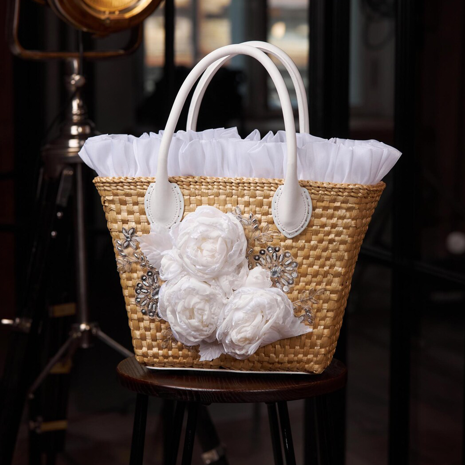 Natural Beige Woven Straw Trapezoidal Hand Tote With Sheer White Floral Rhinestone Front Appliqué, Frilly Rim Trim And Removable Drawstring Fabric Liner