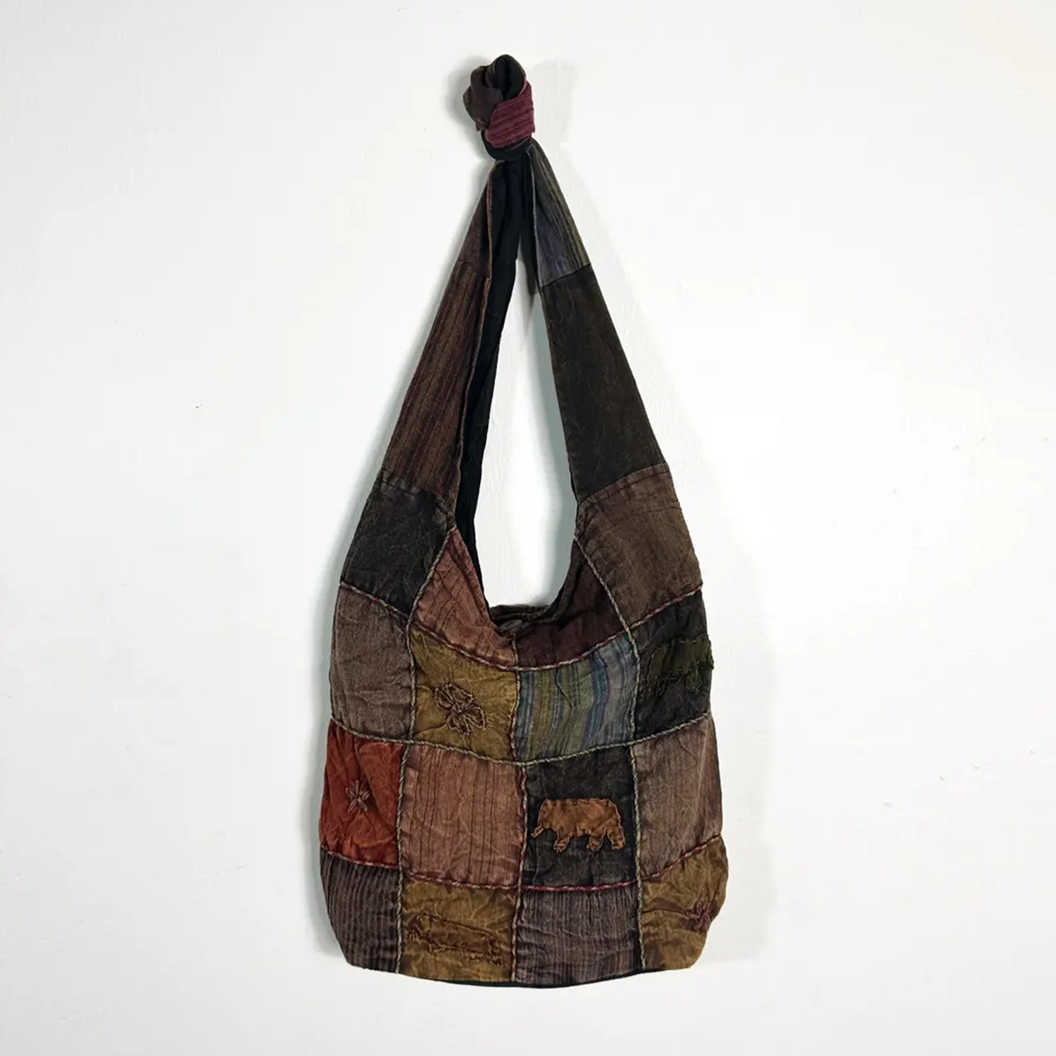 Earthy Vintage Fabric Patchwork Slouch Shoulder Tote With Embroidered Appliqué Panel Detailing, Knotted Fabric Shoulder Strap, Toggle Closure And Dual Inner Zipper Compartments